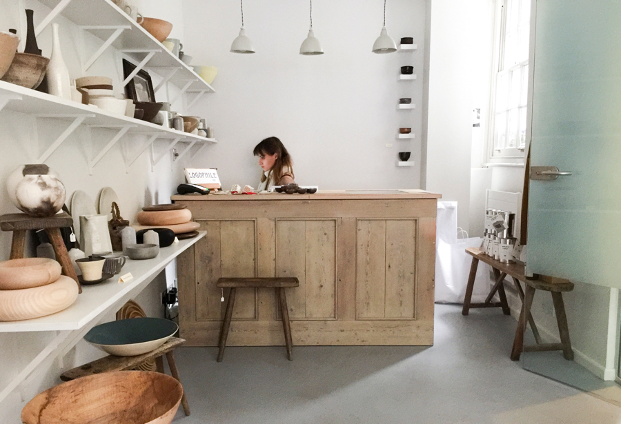 Pared back, minimal shop interior with white walls and gray concreted floor at Maud & Mabel