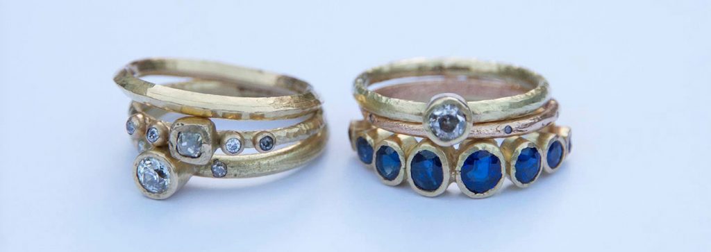 Sapphire and diamonds in gold ring settings