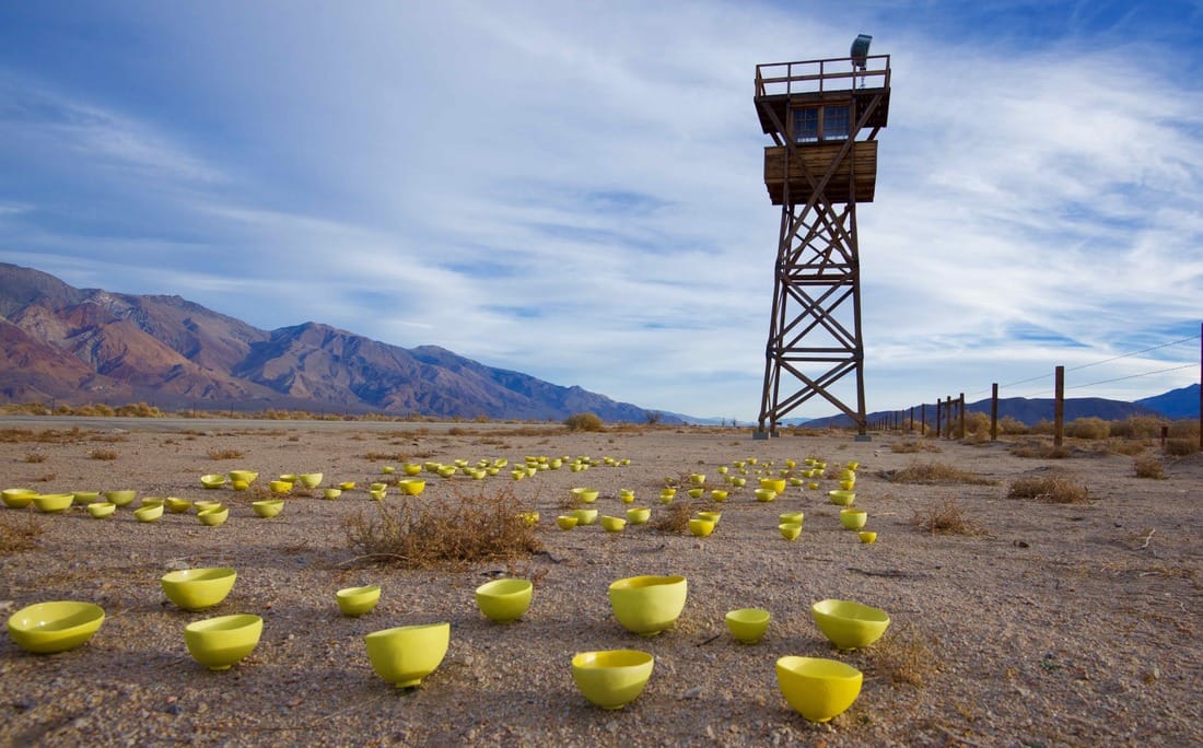 Yellow bowl project under watchtower in Manzanar, Setsuko Sato Winchester