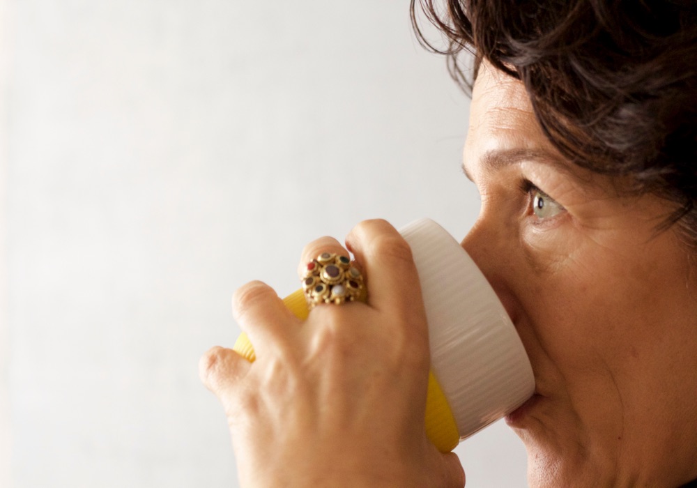Profile of woman drinking from a mug